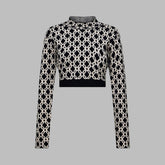Black and white patterned top on a light gray background